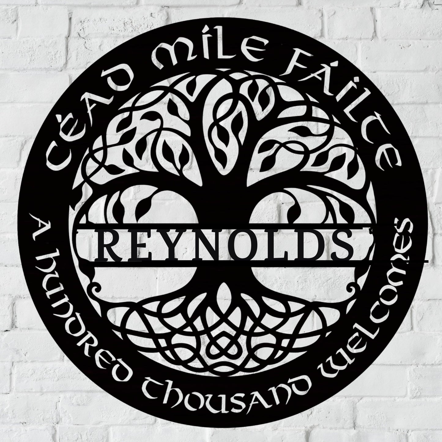Custom metal wall art featuring a Celtic Tree of Life design with intricate knotwork. The text reads &#39;Céad Míle Fáilte&#39; (Irish for &#39;A Hundred Thousand Welcomes&#39;) and includes a customizable family name in the center. Circular black metal sign with elegant craftsmanship, perfect for home decor or as a personalized gift. clickcoastal